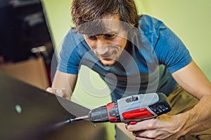 Frustrated Man Putting Together Self Assembly Furniture