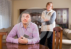 Frustrated man after quarrel with mother