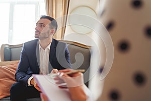 Frustrated man with a short haircut looking away