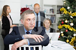 Frustrated man sitting at office