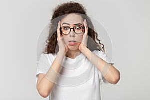 Frustrated millennial girl in glasses feel terrified or scared