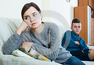 Frustrated mother scolding teenager son