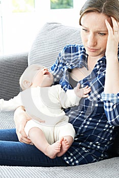 Frustrated Mother Suffering From Post Natal Depression