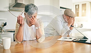 Frustrated senior couple, headache and fight in divorce, debt or financial crisis together at home. Unhappy mature man