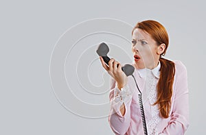 Frustrated shocked woman girl looking at telephone