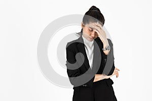 Frustrated stressed Asian business woman with hands on face suffering from severe depression on white isolated background.