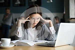 Frustrated stressed student learning difficult exam with laptop