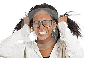 Frustrated stressed woman with glasses pulling her hair out