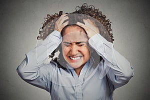 Frustrated stressed young woman having headache bad day