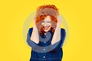 Frustrated stressed young woman. Headshot unhappy overwhelmed girl having headache bad day hands on head covering ears out