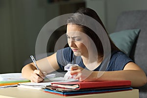 Frustrated student working late hours