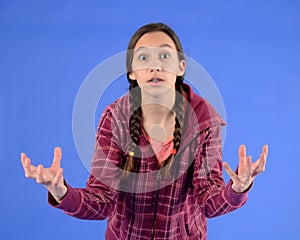Frustrated teen girl with braids with hands out