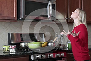 Frustrated woman cooking