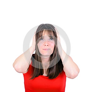 Frustrated woman covering her ears and looking up