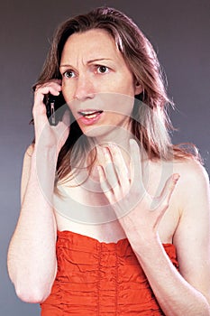 Frustrated woman phone call Isolated classy beautiful young in party dress