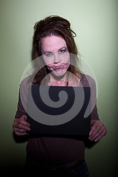 Frustrated woman taking mugshot