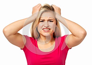 Frustrated Woman Tearing Out Hair On White photo