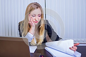 Frustrated worried young woman looks at laptop upset by bad news, teenager feels shocked afraid reading negative bullying message,