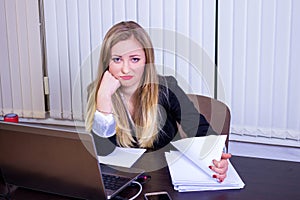 Frustrated worried young woman looks at laptop upset by bad news, teenager feels shocked afraid reading negative bullying message,