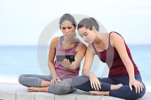 Frustrated yogis watching yoga tutorial online photo