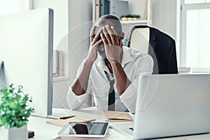 Frustrated young African man in formalwear