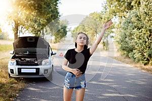 Frustrated young driver tries to stop another car and ask for a help