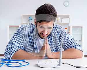 Frustrated young man due to weak internet reception