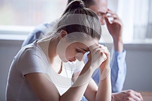 Frustrated young spouses after quarreling at home