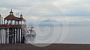 Frutillar Bajo, Chile: pier and bay of city with Osorno volcano on background