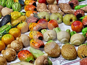 Frutta Martorana typical Sicilian pastries of almond paste shaped in fruits and vegetables photo