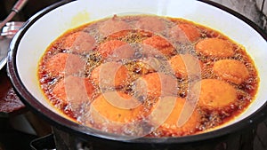 Frying acaraje in palm oil