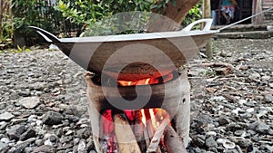 frying in a clay oven and firewood