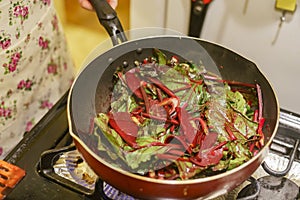 Frying delicious beets and leaves in a non stick pan