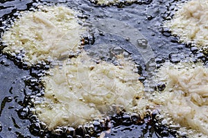 Frying latkes from above closeup