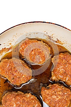Frying Meatballs in the deep hot oil in the frying pan