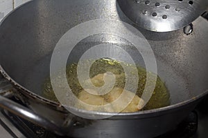 Frying pakode in pan with oil, very popular street food in India.famous indian food, Selective focus on subject