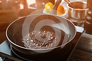 Frying pan with boiling liquid.