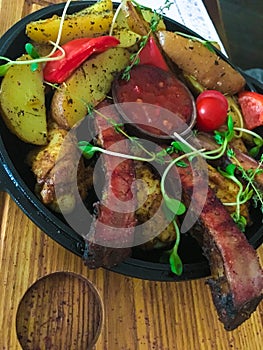 Frying pan with moss and potatoes