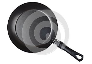 Frying pan with non-stick surface isolated on white