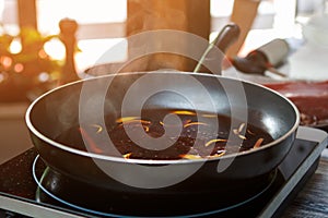 Frying pan with orange peel.