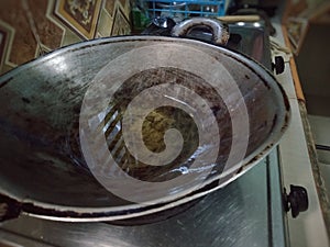 A frying pan on the stove in the kitchen ready for cooking culinary