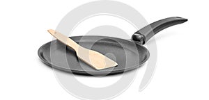 Frying pan with wooden spade on white background