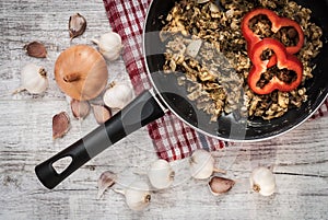 Frying pan on wooden table