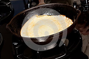 Frying pancake mix into pan
