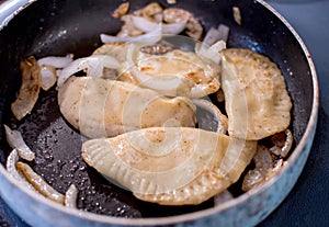 Frying pirogi on a stove top