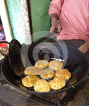 Frying pooris in India