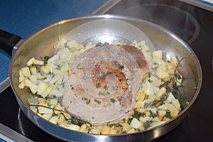 frying roast with apple and herbs