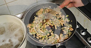 Frying salmon pieces in a cream