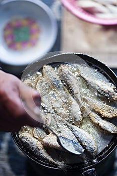 Frying small sardines fish, Chefchouen, Morocco photo