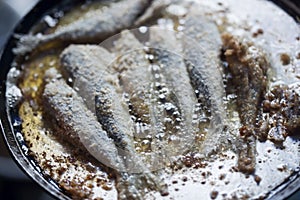 Frying small sardines fish, Chefchouen, Morocco photo